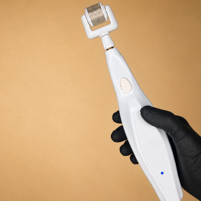 Plexr Lumen plasma energy microneedling device held in a gloved hand