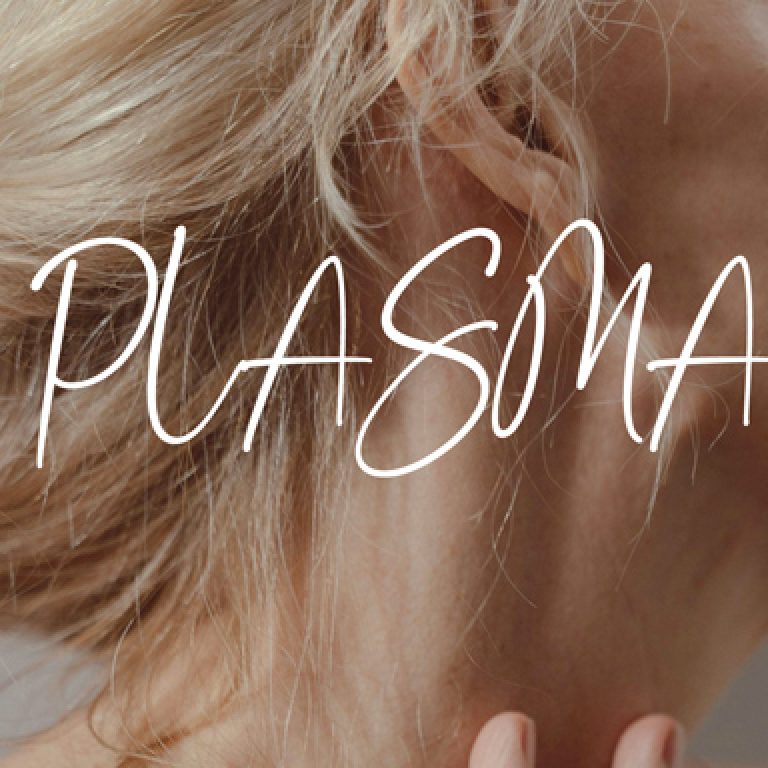 Close-up of a woman’s neck and jawline with eyes closed, representing skin and plasma energy